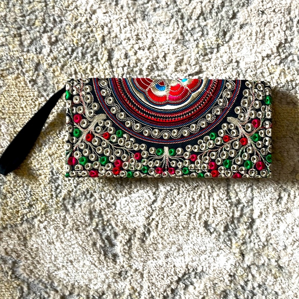 Eye catching embroidered clutch.